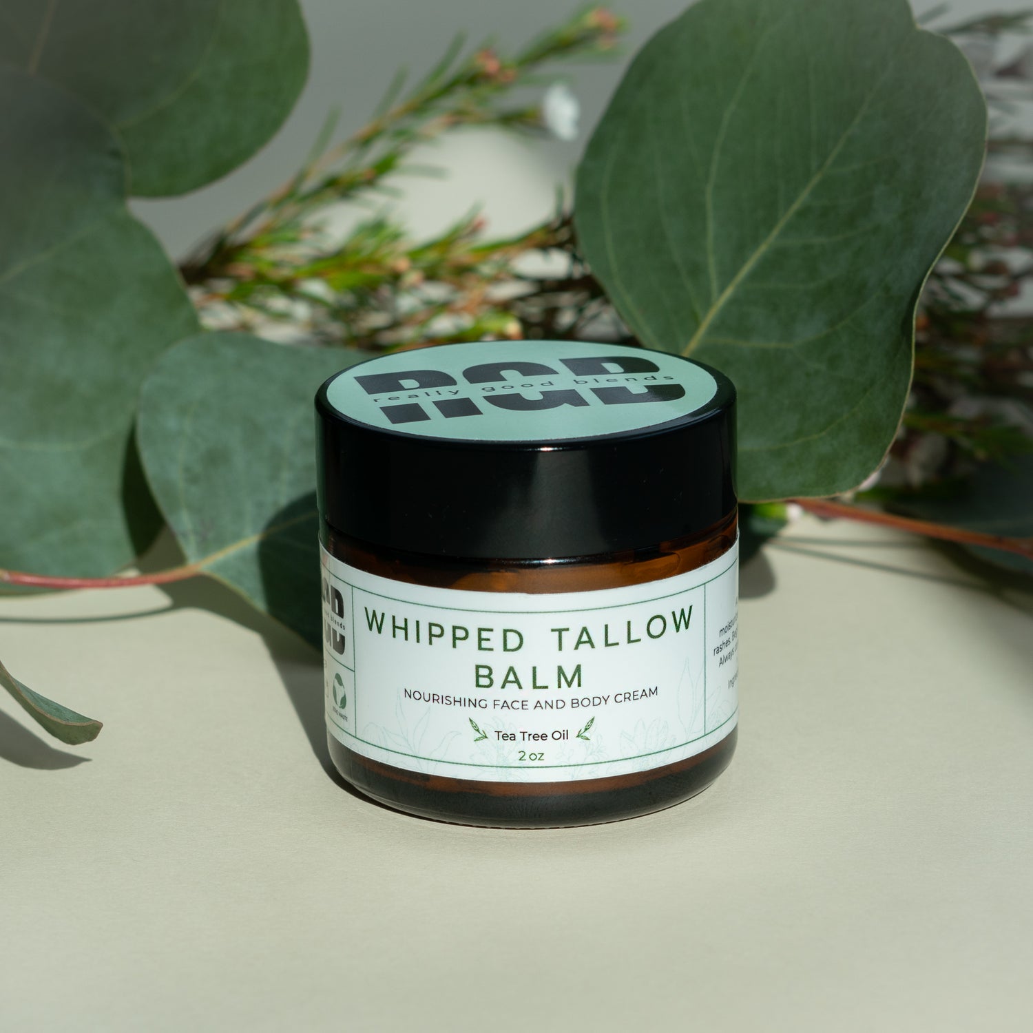 Whipped tallow balm with tea tree in a glass jar – natural tallow balm infused with tea tree oil for deep hydration and soothing skincare.
