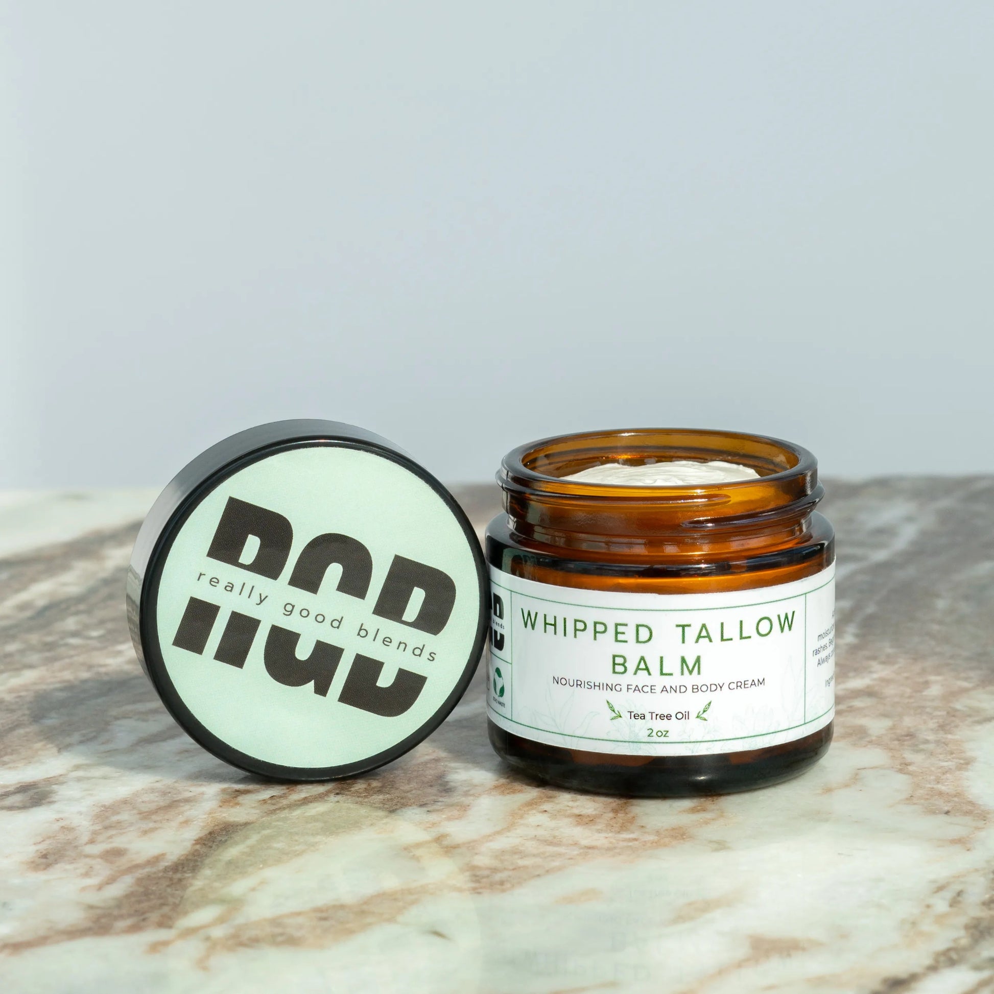 Whipped tallow balm with tea tree in a glass jar – natural tallow balm infused with tea tree oil for deep hydration and soothing skincare.